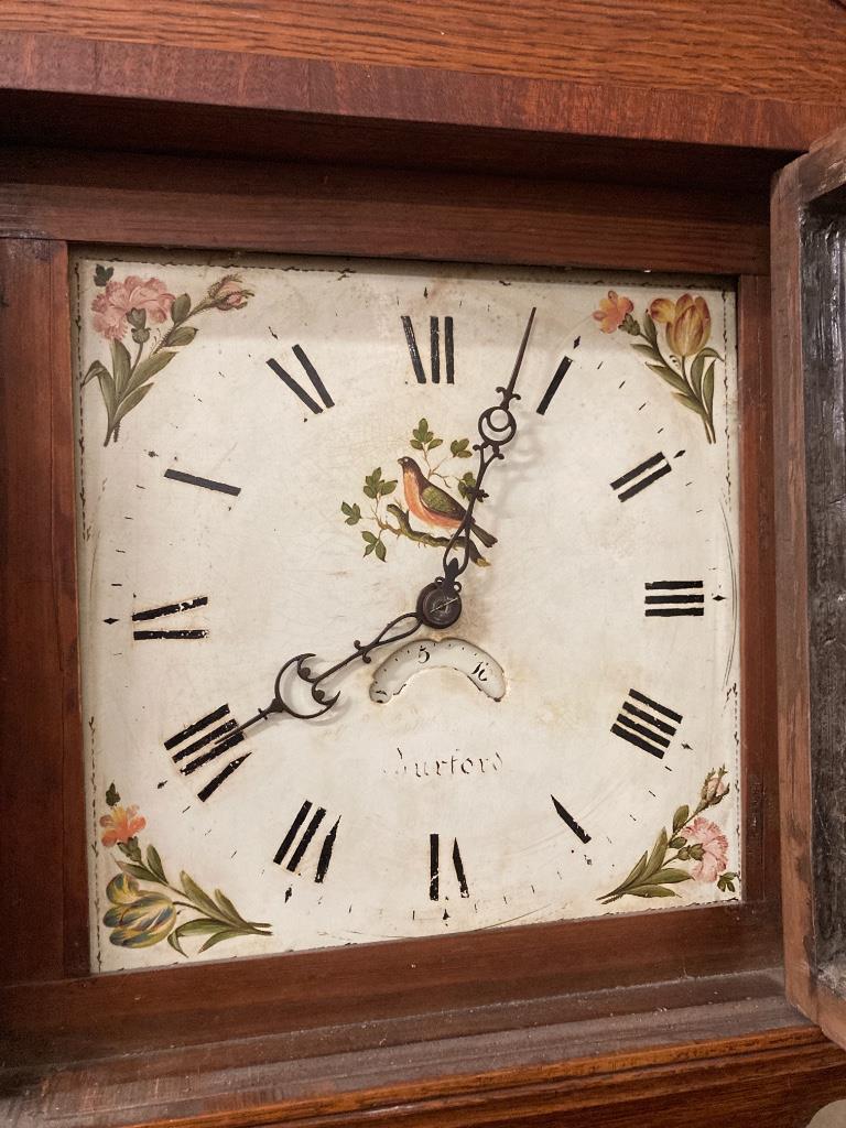 An early 19th century oak cased 30 hour longcase clock, height 207cm